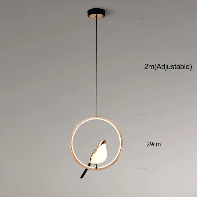 AuriBird: Lampada a sospensione di design dorata con uccello – Luce elegante per spazi abitativi tranquilli