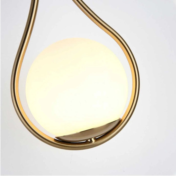 AuriLune: Applique di design con sfera di vetro – Elegante lampada da parete in stile moderno