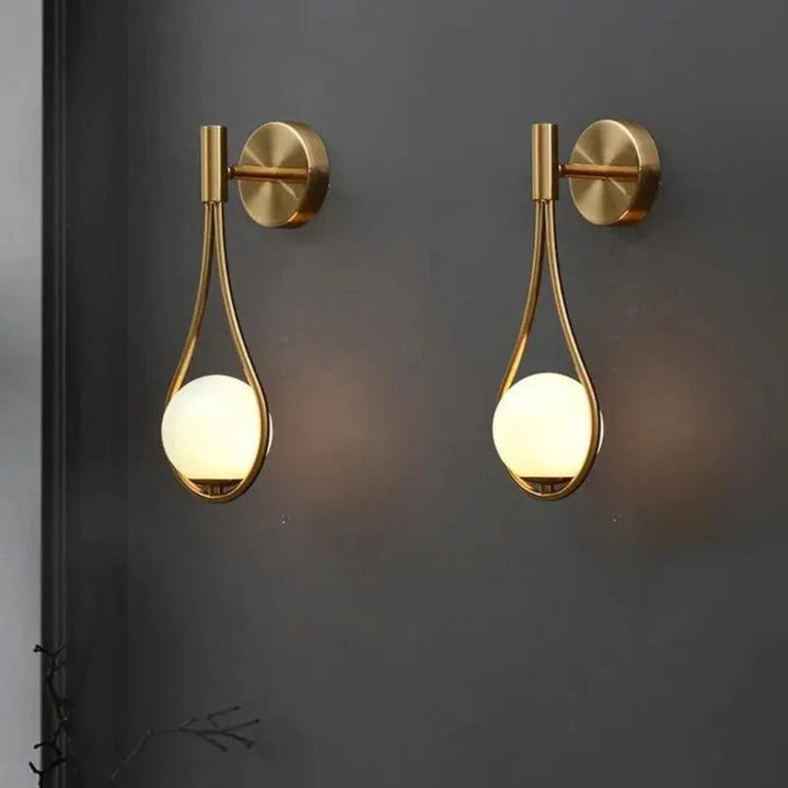 AuriLune: Applique di design con sfera di vetro – Elegante lampada da parete in stile moderno