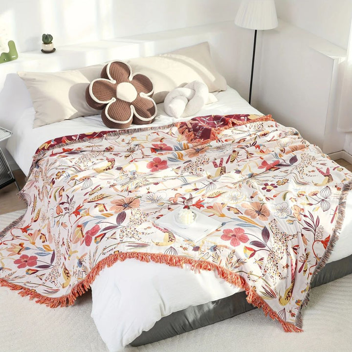 Dschungelblüte: Coperta in cotone reversibile con motivo floreale tropicale e struttura leggera – per divano e camera da letto