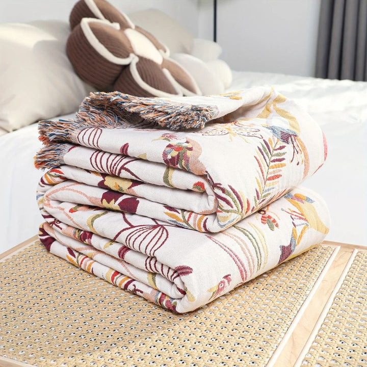 Dschungelblüte: Coperta in cotone reversibile con motivo floreale tropicale e struttura leggera – per divano e camera da letto