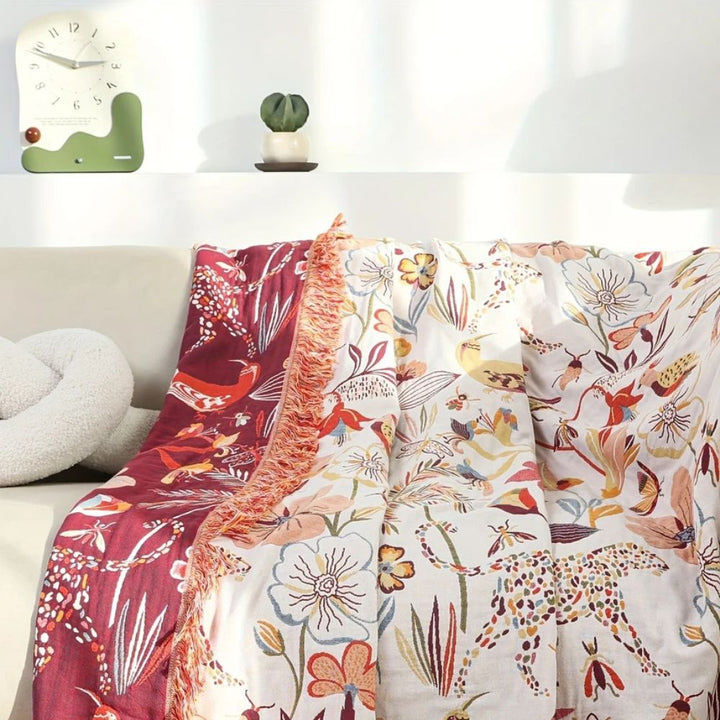 Dschungelblüte: Coperta in cotone reversibile con motivo floreale tropicale e struttura leggera – per divano e camera da letto