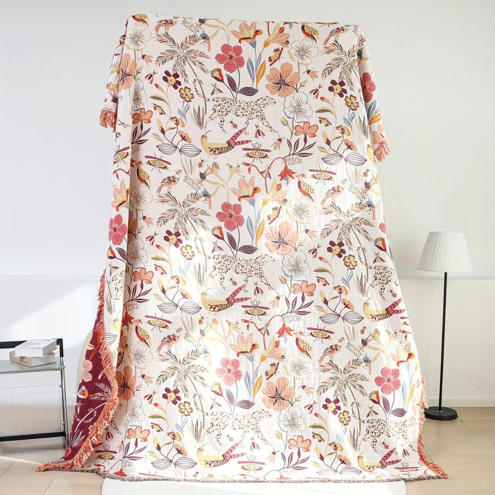 Dschungelblüte: Coperta in cotone reversibile con motivo floreale tropicale e struttura leggera – per divano e camera da letto