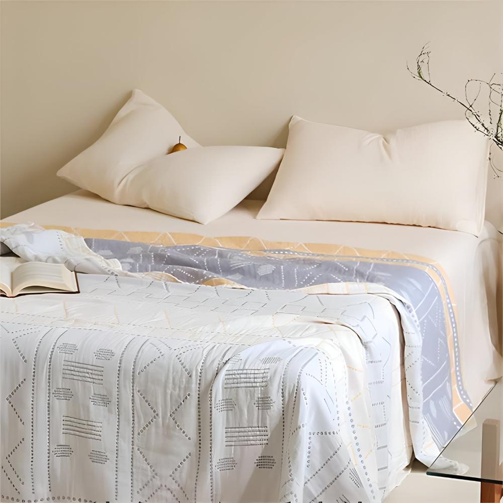GeoSanft: Coperte in cotone biologico con moderno motivo geometrico e struttura traspirante – per divano e camera da letto