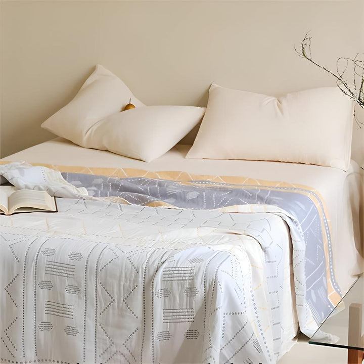 GeoSanft: Coperte in cotone biologico con moderno motivo geometrico e struttura traspirante – per divano e camera da letto