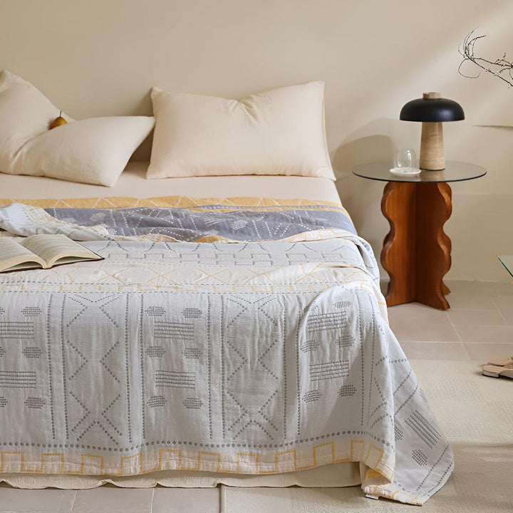 GeoSanft: Coperte in cotone biologico con moderno motivo geometrico e struttura traspirante – per divano e camera da letto