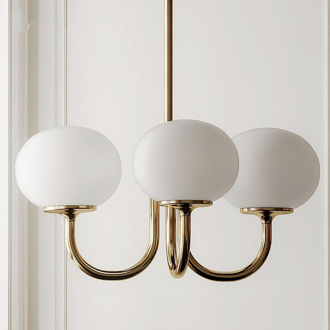 LumiRosé: Lampadario Designer con finitura dorata e paralumi in vetro