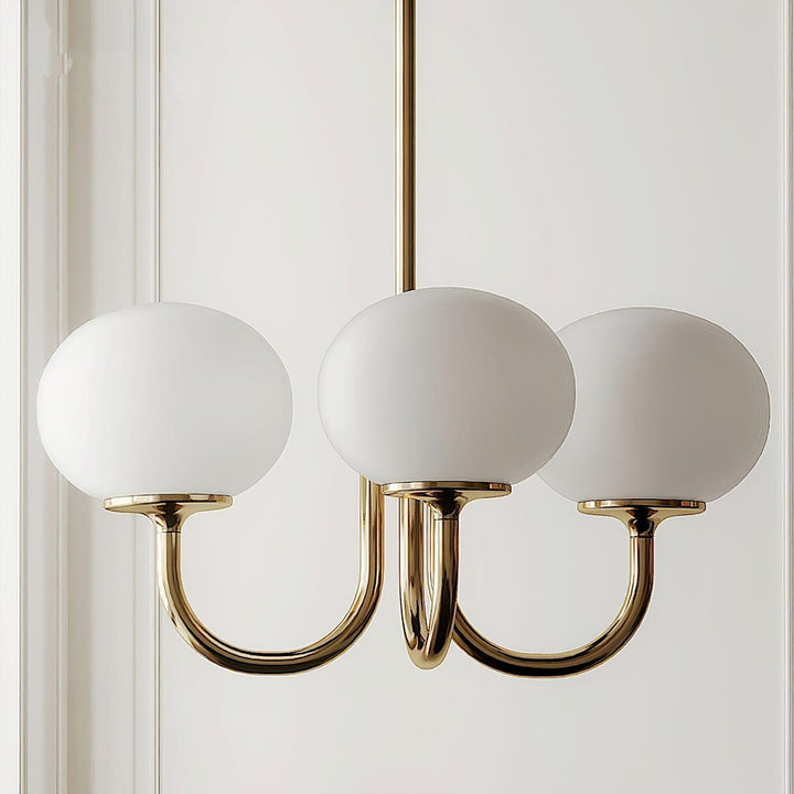 LumiRosé: Lampadario Designer con finitura dorata e paralumi in vetro
