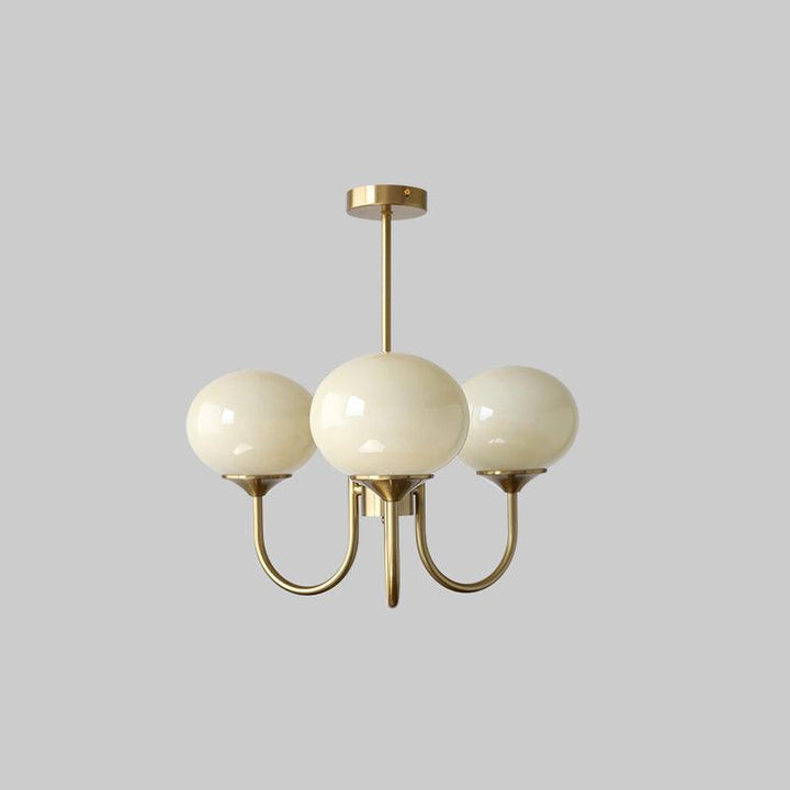 LumiRosé: Lampadario Designer con finitura dorata e paralumi in vetro