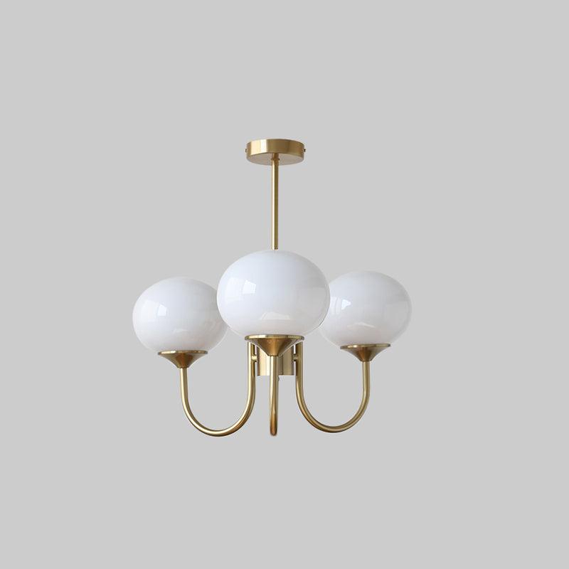 LumiRosé: Lampadario Designer con finitura dorata e paralumi in vetro
