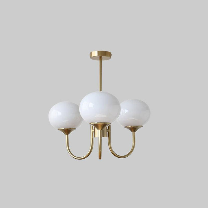 LumiRosé: Lampadario Designer con finitura dorata e paralumi in vetro