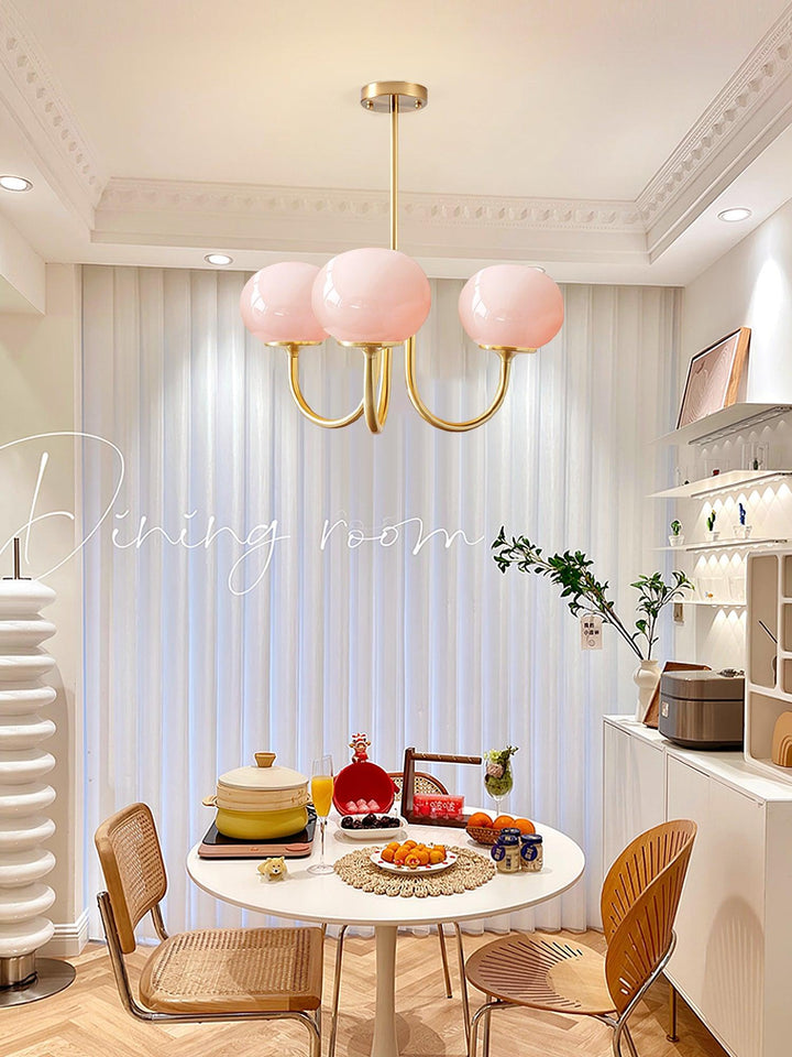 LumiRosé: Lampadario Designer con finitura dorata e paralumi in vetro