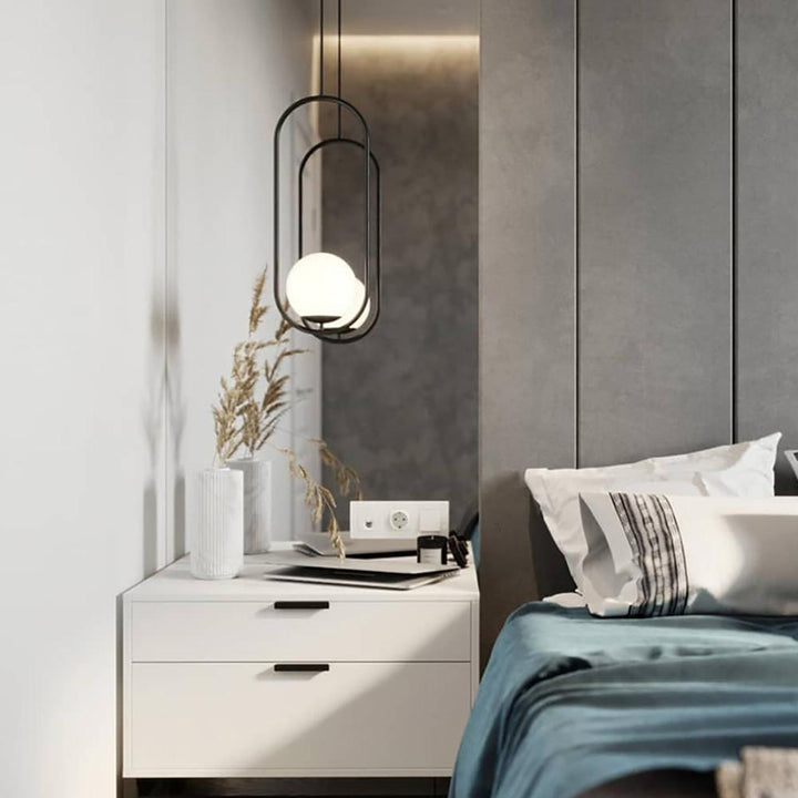 Milora: Lampada a sospensione in vetro e metallo con silhouette slanciata – per interni moderni