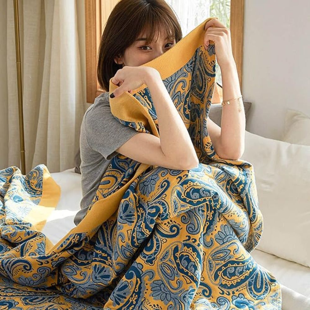 RetroSoleil: Coperte in cotone con classico motivo retrò e leggerezza traspirante – per divano e area living