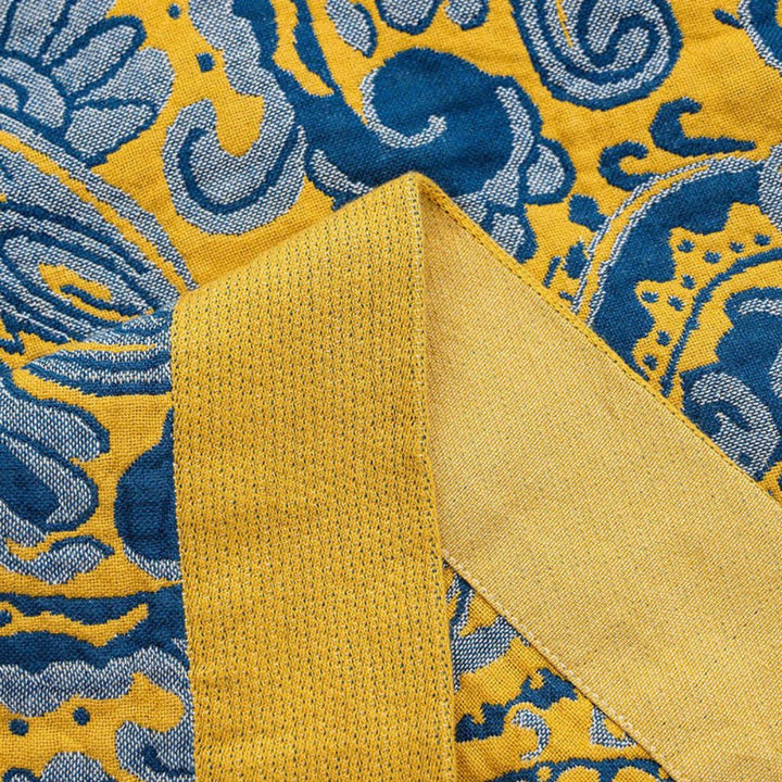 RetroSoleil: Coperte in cotone con classico motivo retrò e leggerezza traspirante – per divano e area living